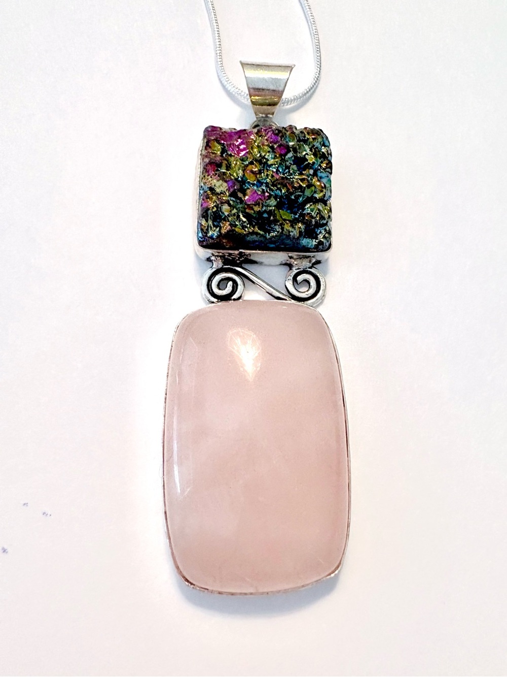 Beautiful, Rose Quartz and Titanium Druzy pendant on a silver chain.